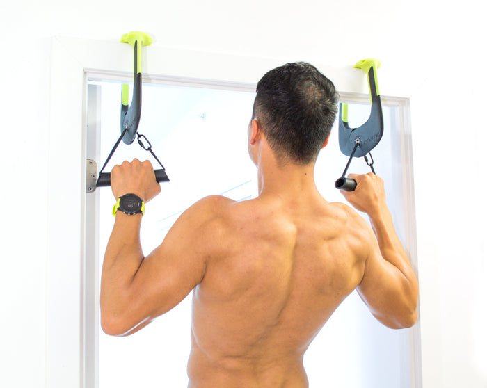 Man using Duonamic Eleviia doorway handles for pull-ups.