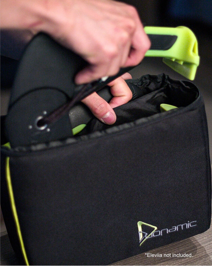 Duonamic travel bag with portable fitness equipment packed for transport and storage.